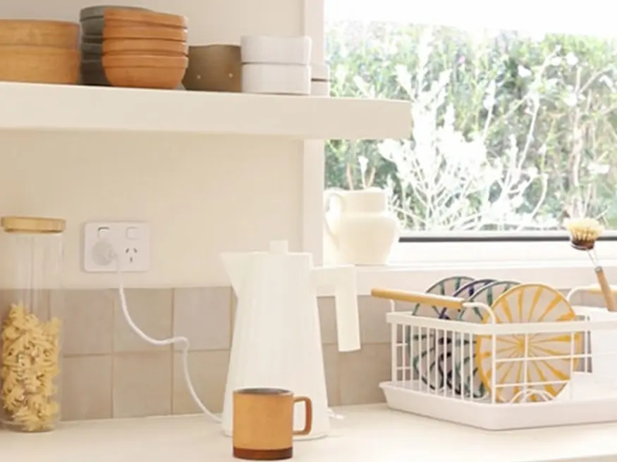 Modern kitchen with white kettle.