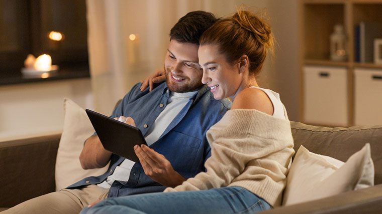 Couple browsing an iPad