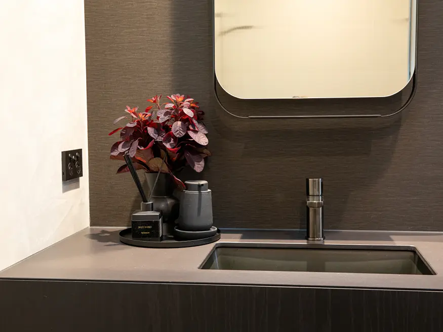 Bathroom sink with mirror and faucet.