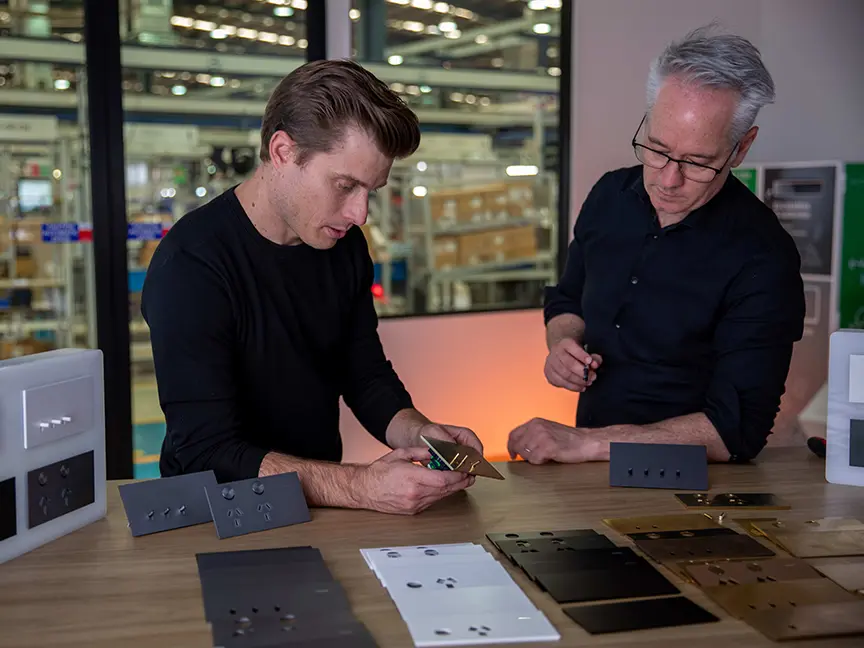 Tim Turrini-Rochford and Jim Hannon-Tan looking at the final design of Clipsal Solis.