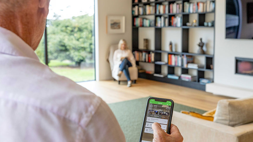 Homeowner using Wiser Smart Home app