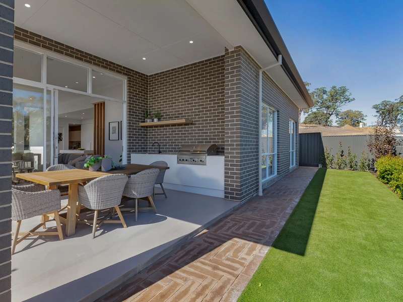 An outdoor patio showcasing a dining table with chairs