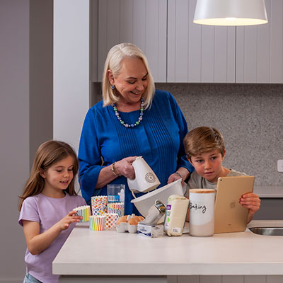 Family baking pastries in kitchen together