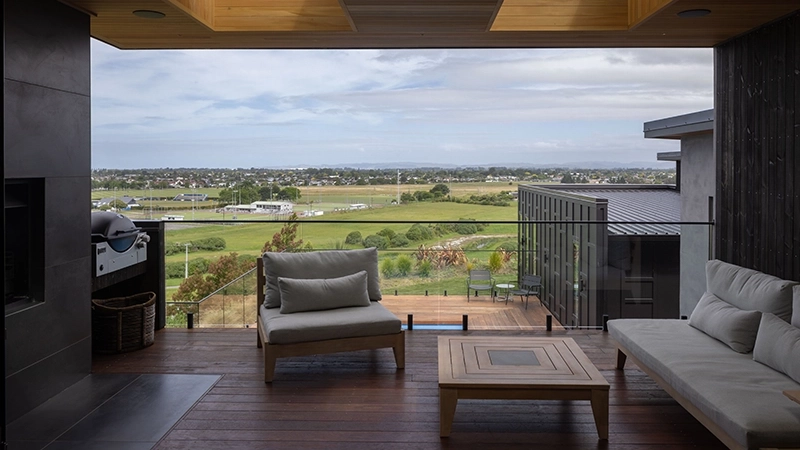 An outdoor living room with a landscape view