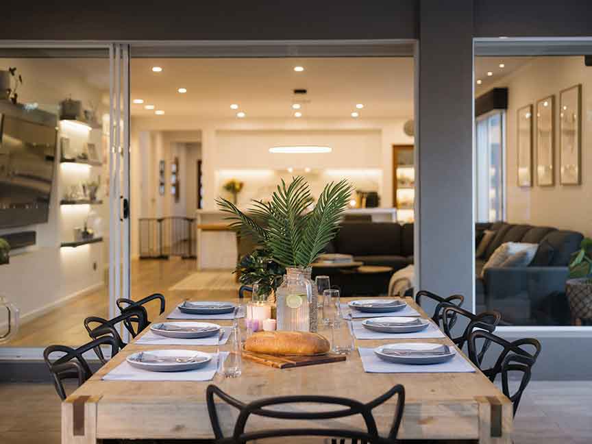 A modern dining area with a clean-lined table and stylish chairs