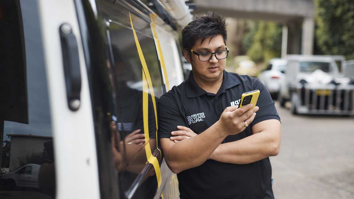 Electrician reading about Clipsal's Trade Software Tools