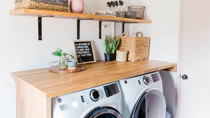 A clean and organized laundry room with a washer and dryer